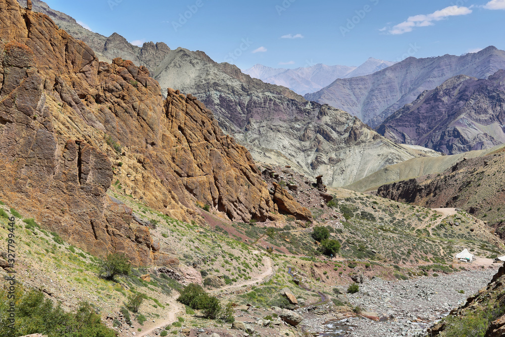 Colorful rugged mountains and river along Markha Valley trek, Ladakh, India.