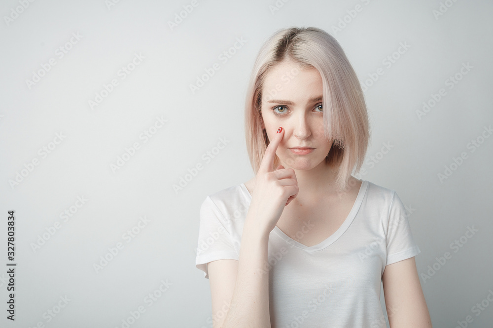 Indoor portrait of sad blonde young woman Indoor portrait of sad blonde young woman