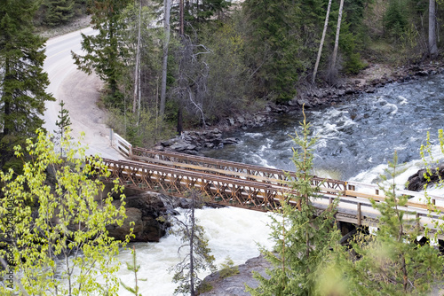 Obraz na płótnie Aerial view of a bridge over a river in the Canadian Rockies during a vibrant sunny summer day. Located in British Columbia, Canada w salonie