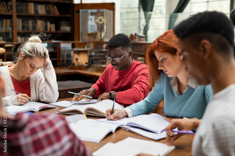 Group of university students studying together Group of university students studying together