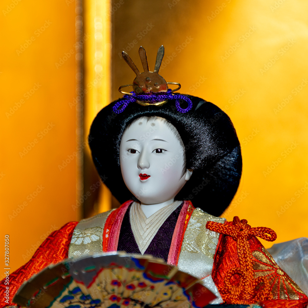 An old and traditional doll representing the empress to celebrate the Girls' Festival in Japan on March 3 An old and traditional doll representing the empress to celebrate the Girls' Festival in Japan on March 3