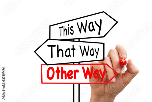 Hand drawn signpost saying this way, that way, the other way concept for lost, confusion or decisions photo