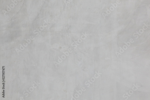 Grey cement wall with rustic natural texture for abstract background and design purpose © Akarawut