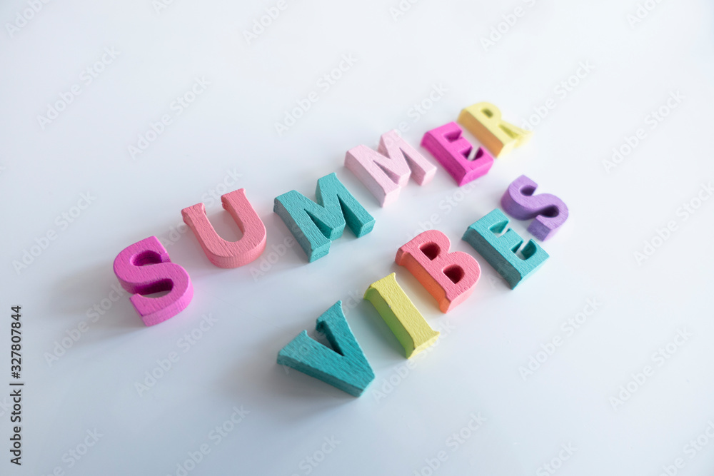Obraz premium Summer word made of colorful wooden Letters isolated on a White Background