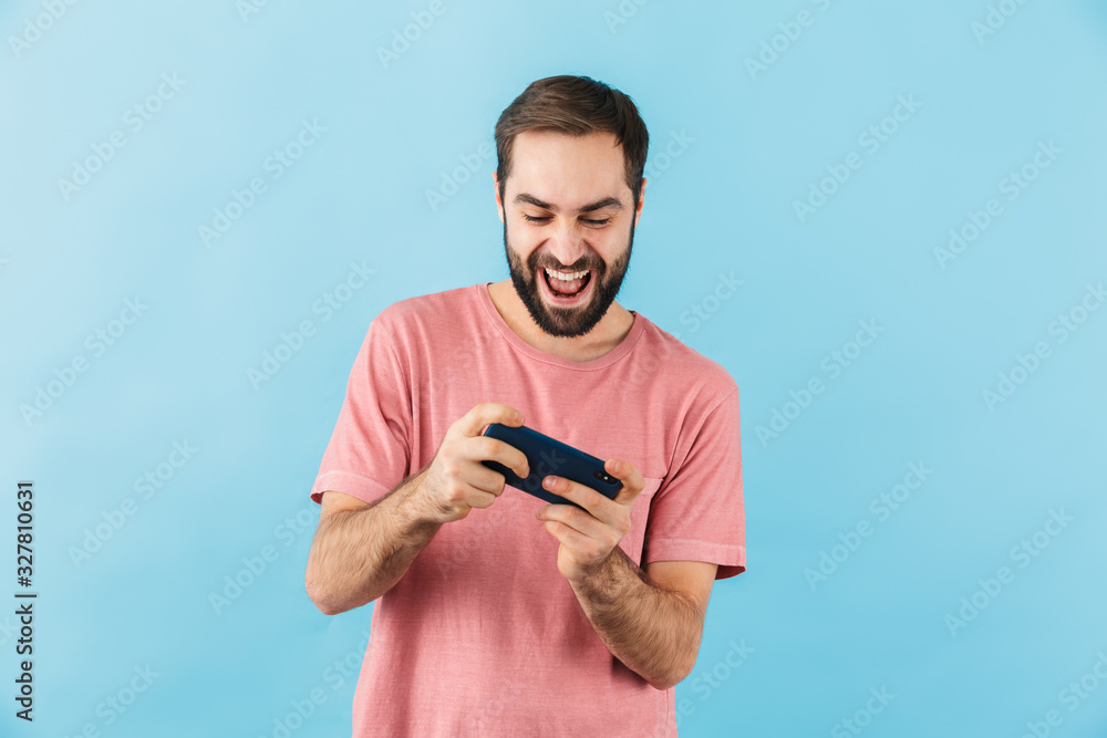 Happy man isolated over blue wall background Happy man isolated over blue wall background