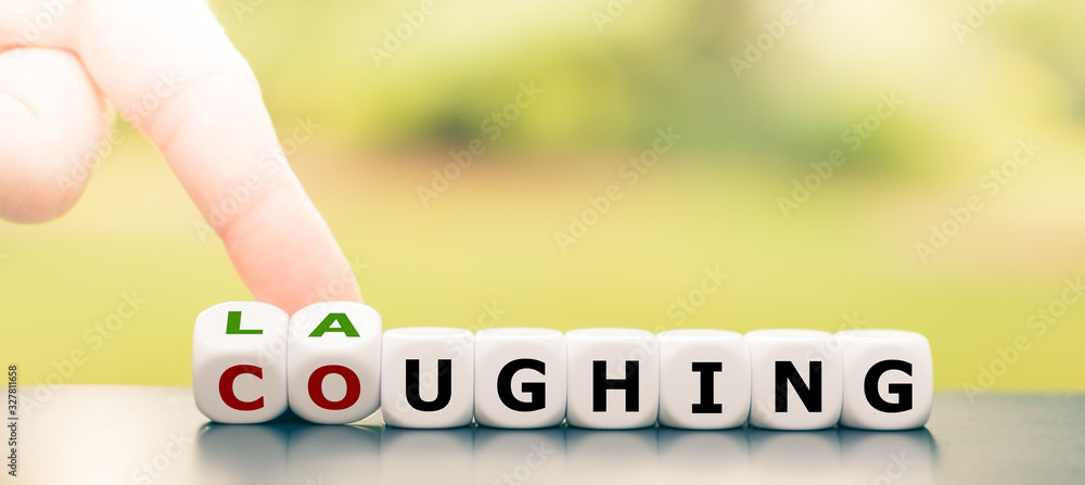 Laughter is the best medicine. Hand turns dice and changes the word