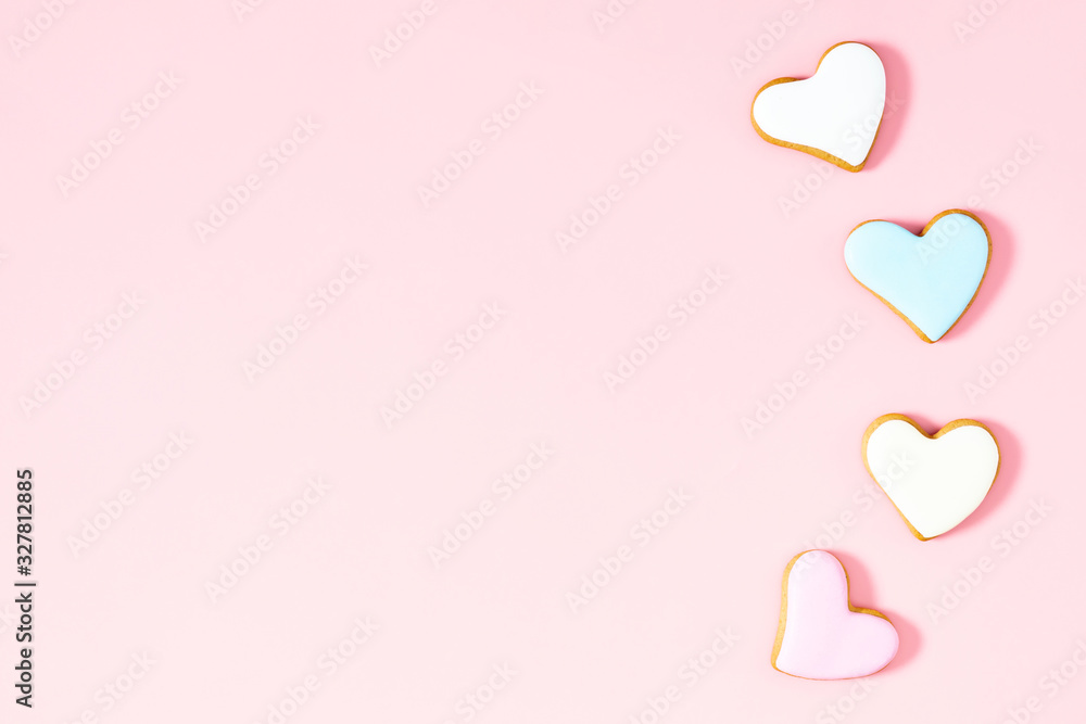 Ginger cookie in shape heart on pastel pink background. Sweet background. Valentine day food, concept, design. Flat lay, top view, copy space