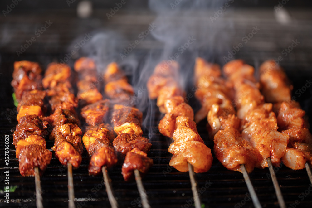 Turkish liver kebab, chicken kebab on fire with smoke Turkish liver kebab, chicken kebab on fire with smoke