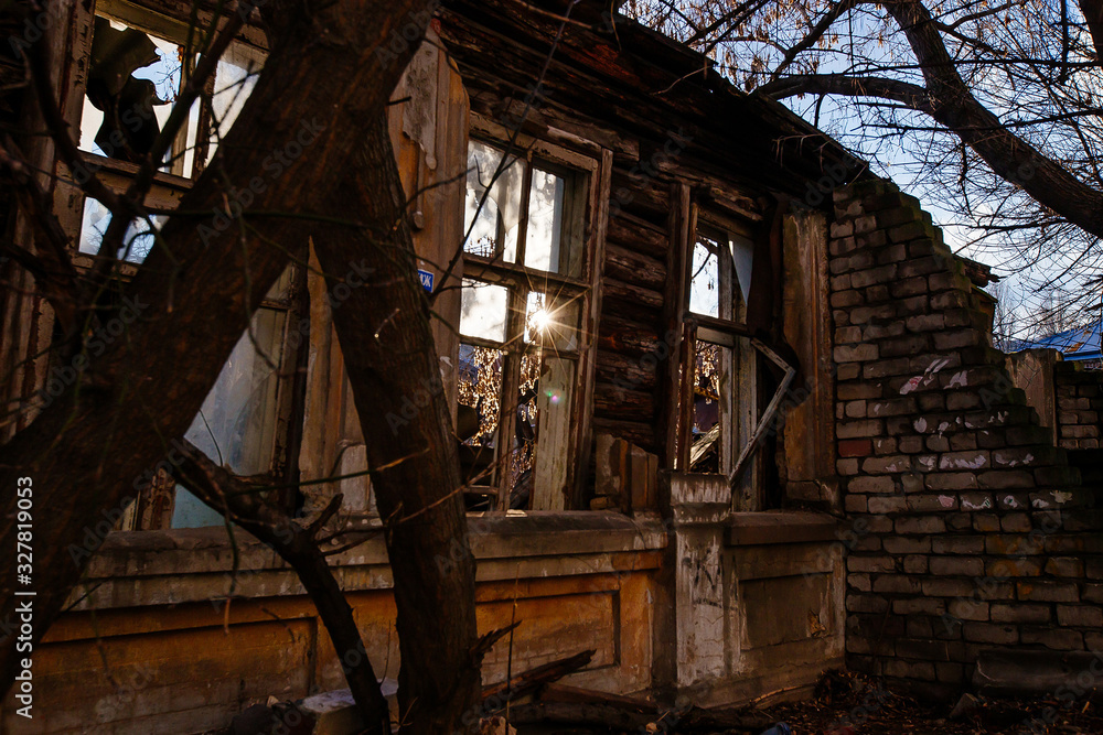 Collapsed ruined old wooden abandoned house in poor district Collapsed ruined old wooden abandoned house in poor district