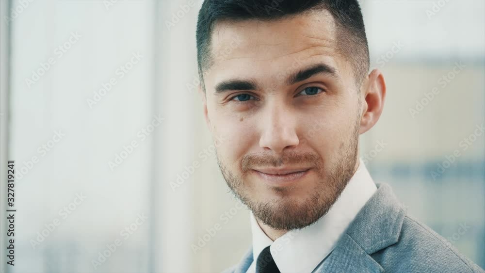 Business man giving a smirk , isolated on white panoramic background. Close up. Copy space. 4K. Business man giving a smirk , isolated on white panoramic background. Close up. Copy space. 4K.