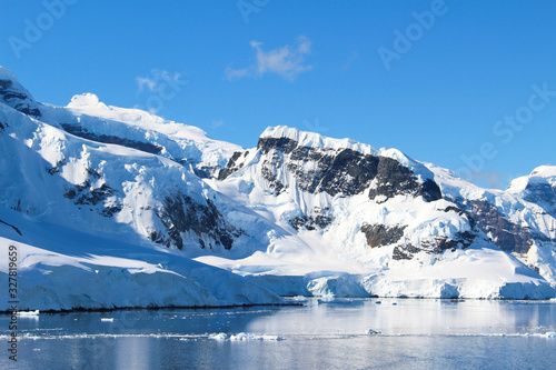 Snow-capped mountains along the coasts of the Antarctic Peninsula, Antarctica