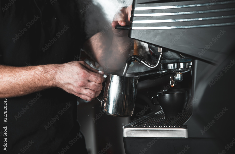 Close up of barista hands preparing cappuccino for customer in coffee shop.