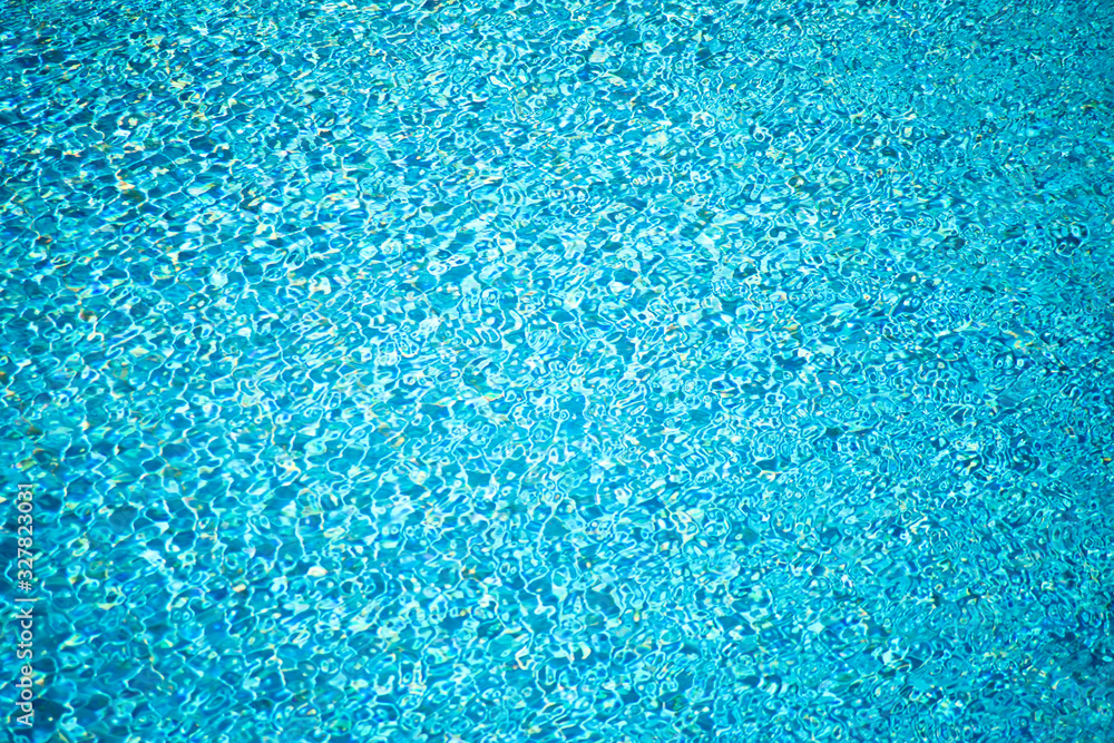 A surface of water in swimming pool. Aqua background