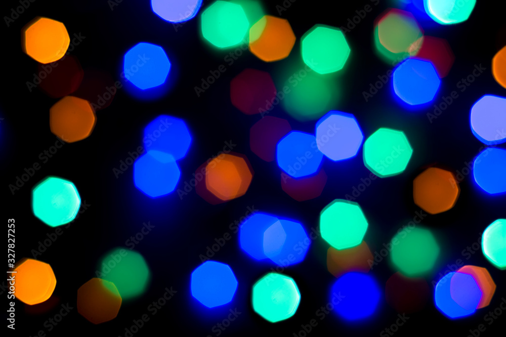 defocused light of multi-colored light bulbs at night defocused light of multi-colored light bulbs at night