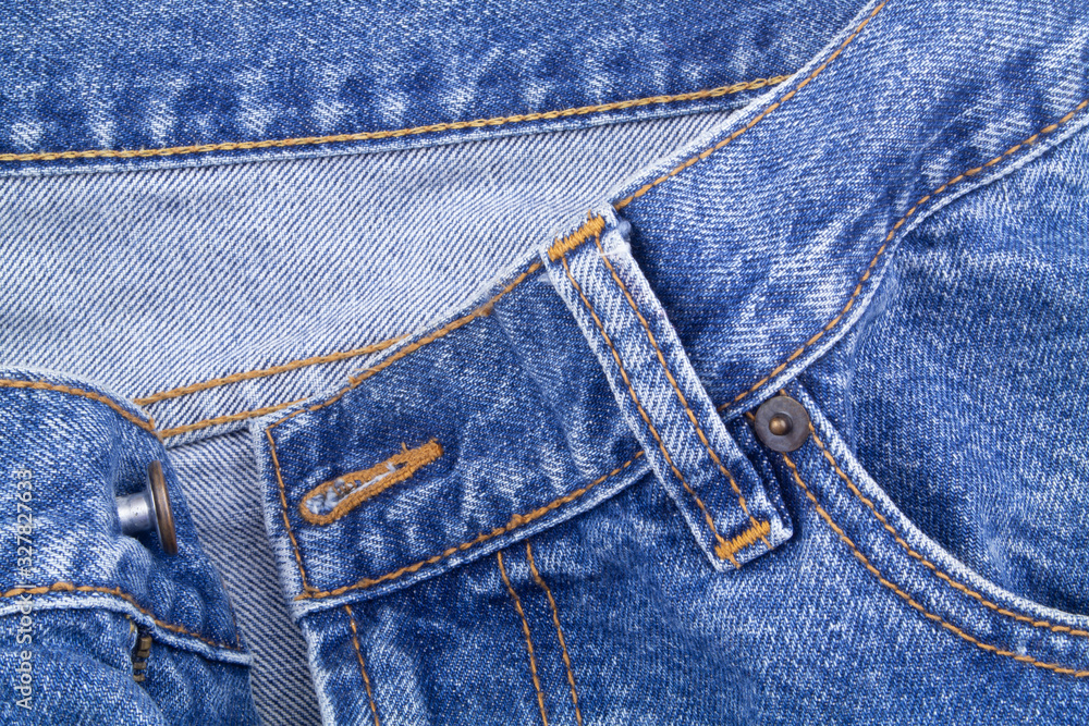 Zipper and pockets of jeans as fashion background Zipper and pockets of jeans as fashion background