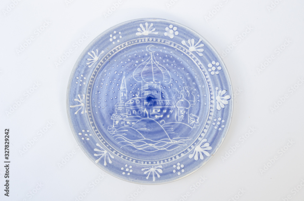 Blue ceramic plate with arabian cityscape - isolated on white background