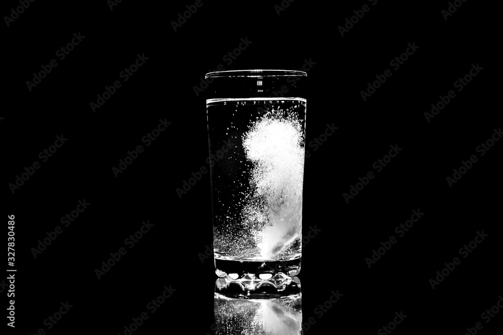 Aspirin dissolves in a glass of water. Aspirin dissolves in a glass of water.
