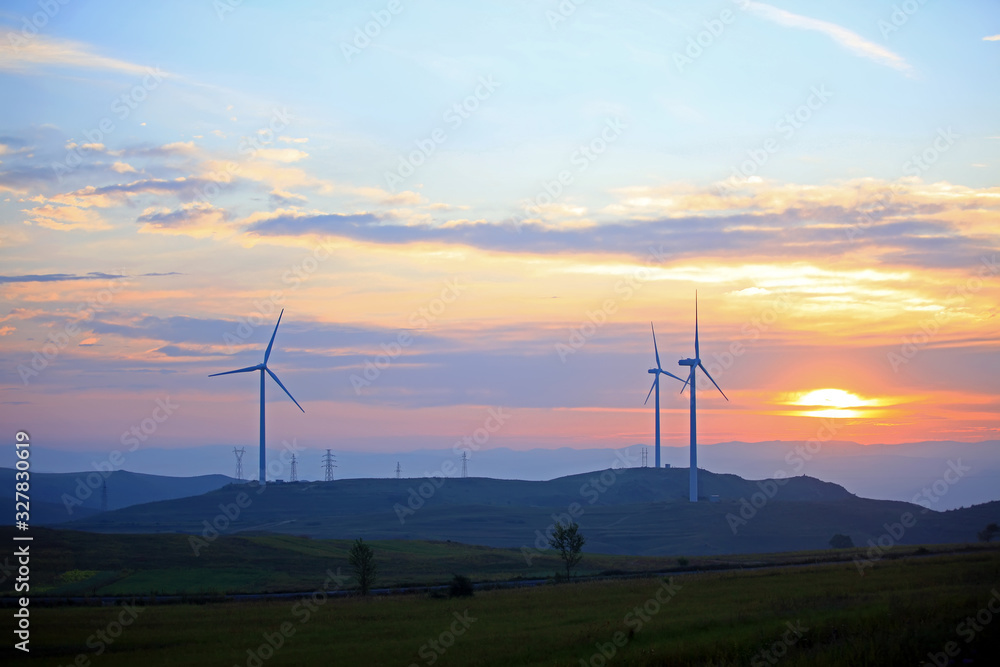 Obraz premium Wind turbines in the evening
