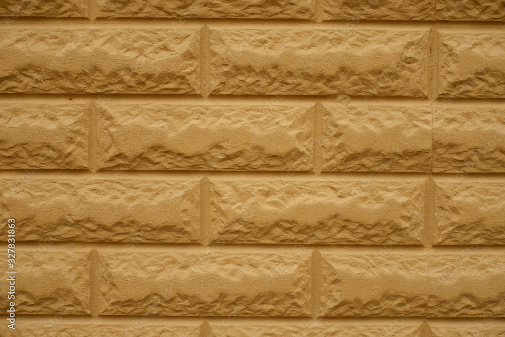 Closeup of yellowish orange common bond brickwork (front view)