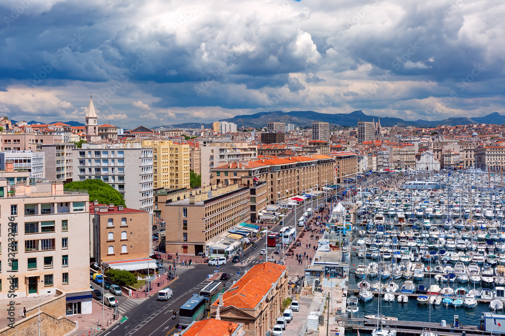 Fototapeta premium Aerial view of Old Vieux Port on sunny day in the historical city center of Marseilles, France