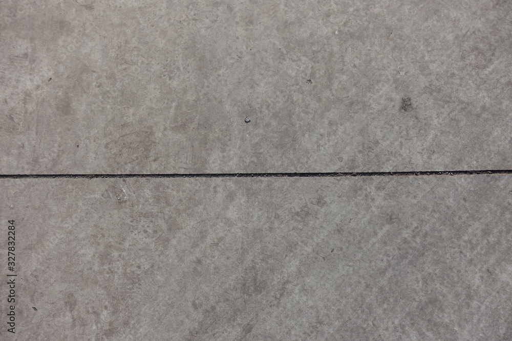 Fototapeta premium Horizontal joint between two grey concrete slabs