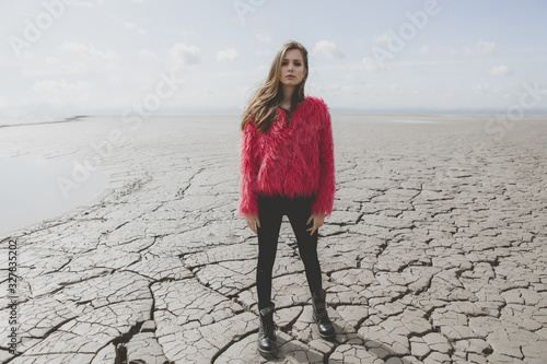 Young woman walking on dry land