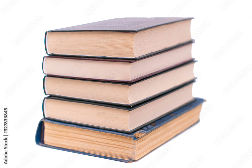 Pile of books in hard covers on a white background, isolate. Pile of books in hard covers on a white background, isolate.