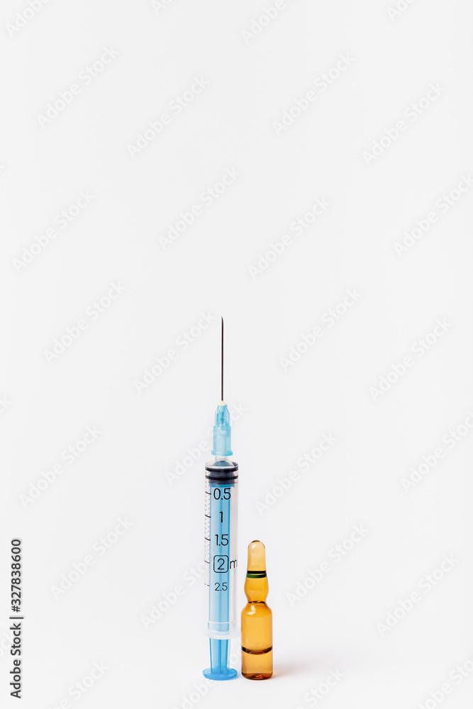 Syringe and vaccine on a white background. Injection on a white background Syringe and vaccine on a white background. Injection on a white background