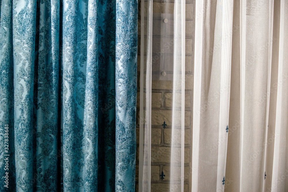 Blue and white curtains against the wall Blue and white curtains against the wall