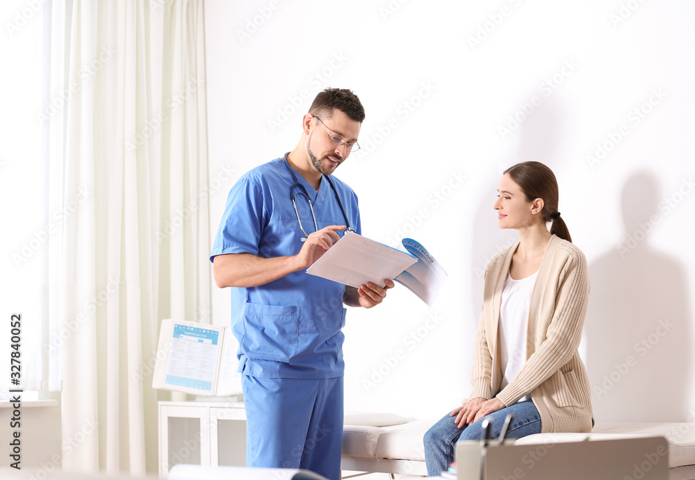 Doctor consulting patient in his office at hospital Doctor consulting patient in his office at hospital