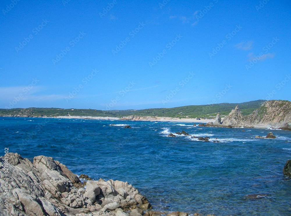 beaches in Sardinia with granite rocks with blue sea