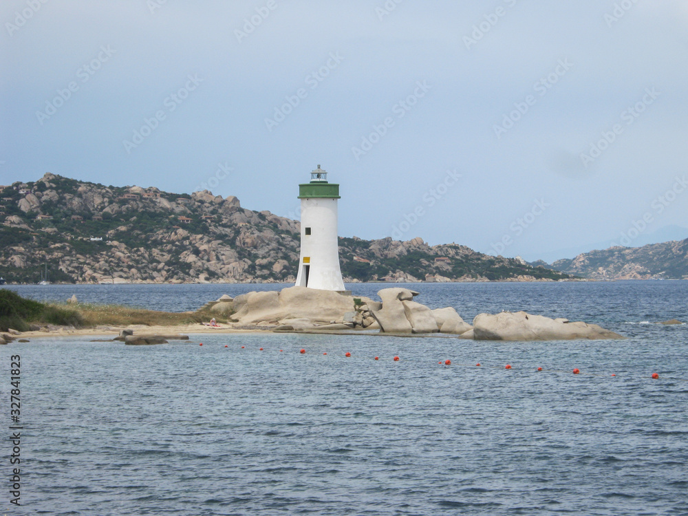 Capo Testa lighthouse in Sardinia on the rocks overlooking the blue sea