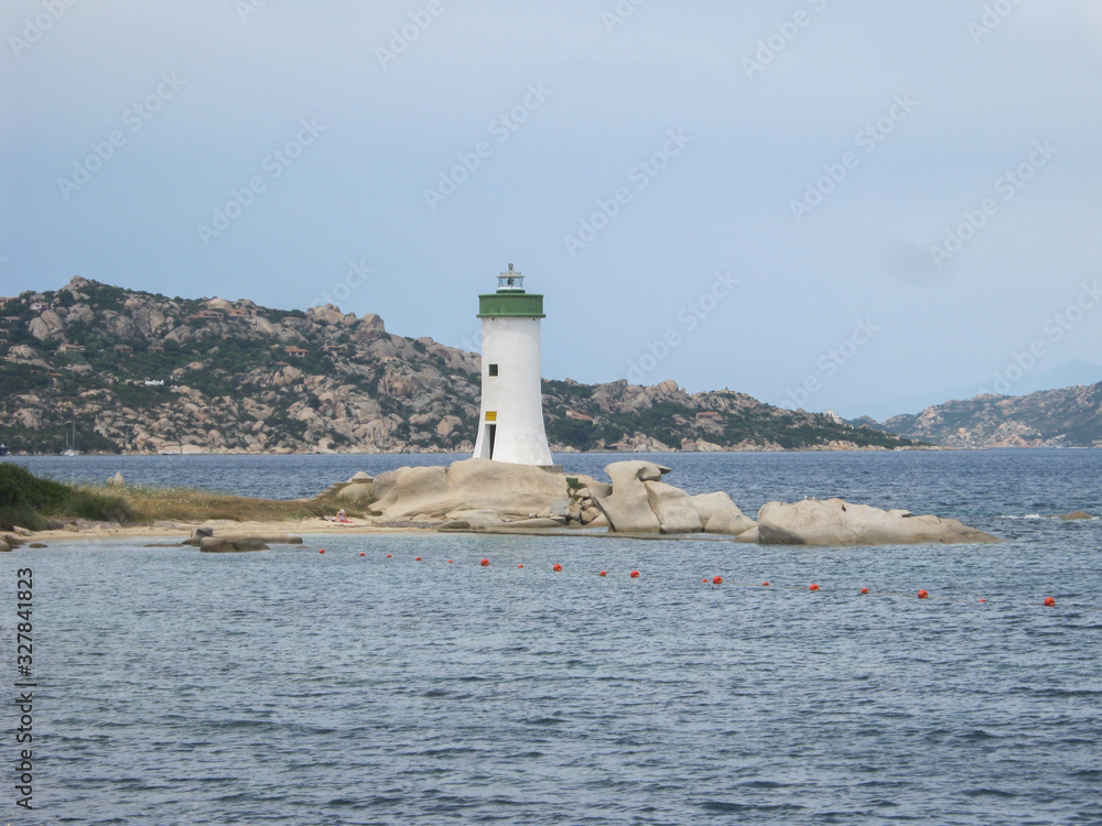Capo Testa lighthouse in Sardinia on the rocks overlooking the blue sea Capo Testa lighthouse in Sardinia on the rocks overlooking the blue sea