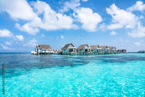 Overwater villas in the blue lagoon