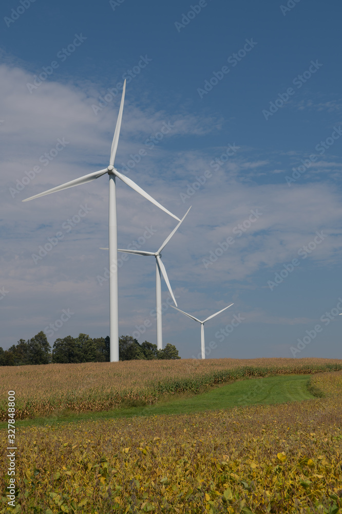 Wind Turbines Against Blue Sky in Rural Area Wind Turbines Against Blue Sky in Rural Area
