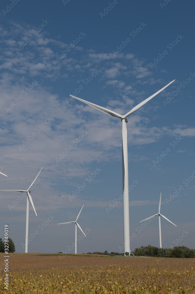 Wind Turbines Against Blue Sky in Rural Area Wind Turbines Against Blue Sky in Rural Area