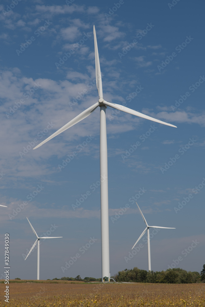Wind Turbines Against Blue Sky in Rural Area Wind Turbines Against Blue Sky in Rural Area