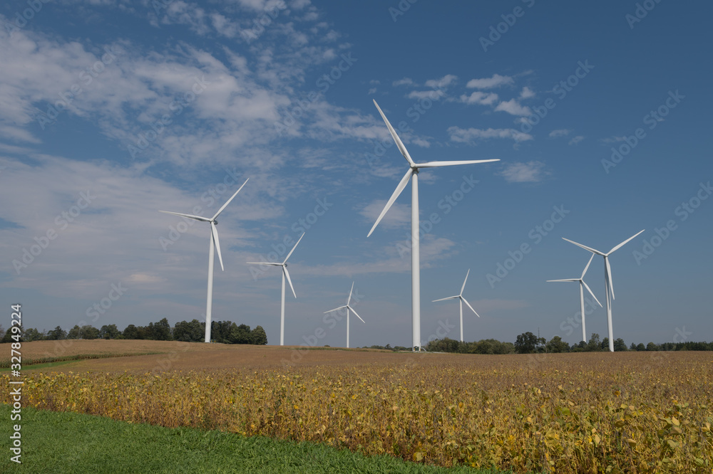 Wind Turbines Against Blue Sky in Rural Area Wind Turbines Against Blue Sky in Rural Area