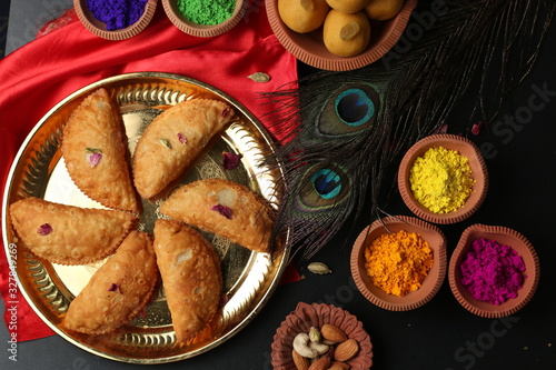 Popular Holi Snack known as Karanji or Gujia is Served on earthen platter. (Holi Concept)