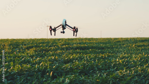In sky flying smart agriculture drone rural aerial helicopter agros copter farm farming field industry landscape meadow nature plant professional vehicle aircraft harvest innovation slow motion