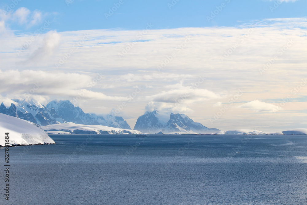 Snow-capped mountains and frozen coasts of the Antarctic Peninsula, Palmer Archipelago, Antarctica
