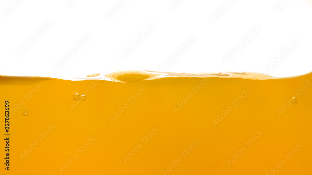 Orange water surface with bubble and water splash on white background Orange water surface with bubble and water splash on white background