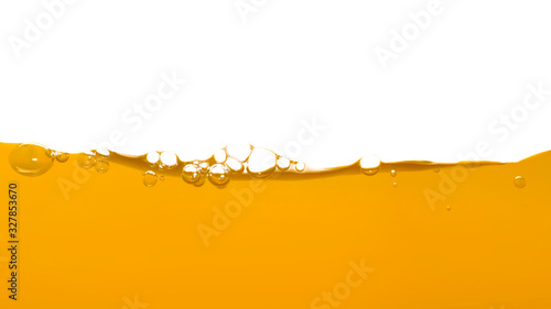 Orange water surface with bubble and water splash on white background