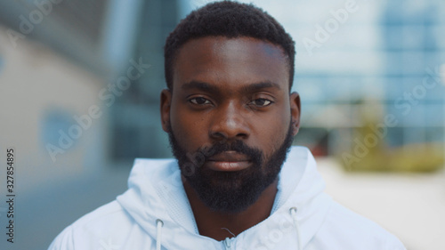 Portrait serious face african american man looking at camera enjoying in urban city handsome confident lifestyle street urban attractive close up confidence outdoors close up slow motion. The best