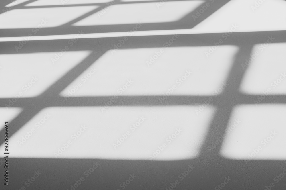 abstract shadow of the window in morning light on white wall texture background abstract shadow of the window in morning light on white wall texture background