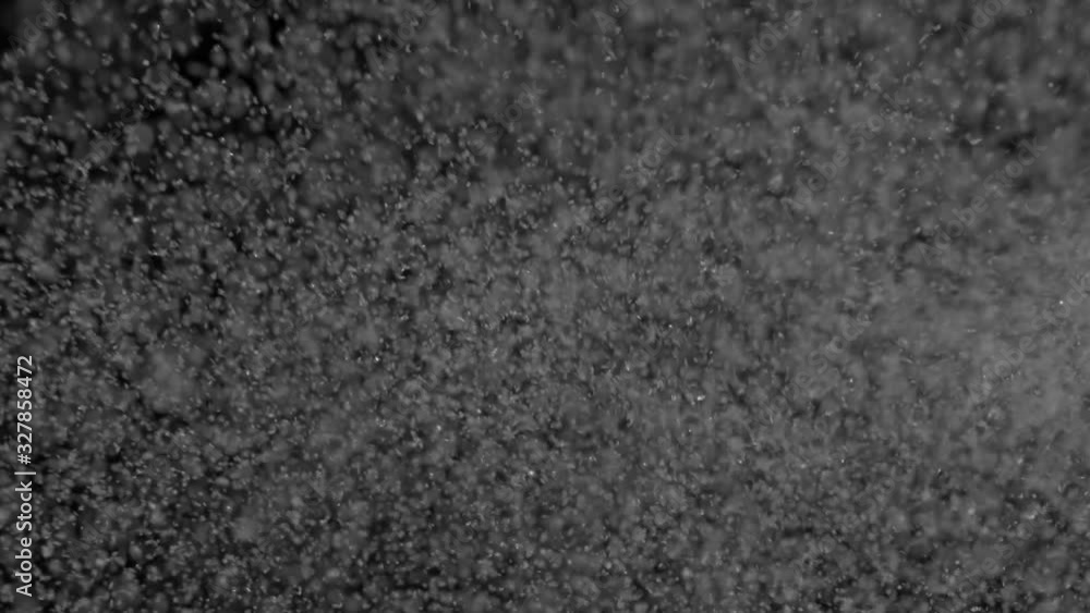 Blowing snow particles isolated on black background Blowing snow particles isolated on black background