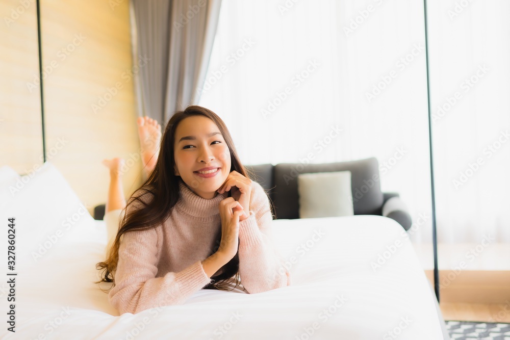 Portrait beautiful young asian woman happy smile relax on bed Portrait beautiful young asian woman happy smile relax on bed