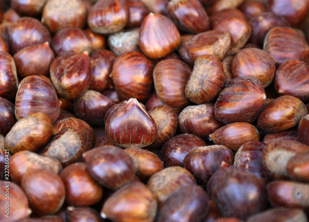 Edible chestnuts texture as very nice food background Edible chestnuts texture as very nice food background