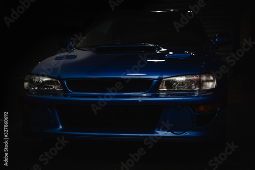 Front view of a blue sport Car made in Japan. Rally icon. photo