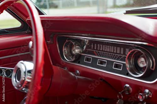 American Classic Dashboard in antique muscle car. Red interior.